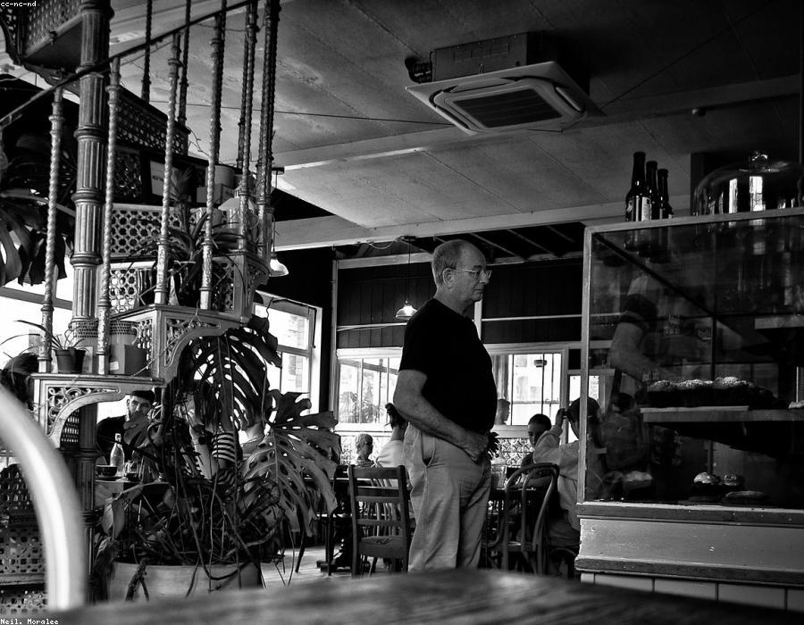 Sunlit corner table in a busy neighbourhood café